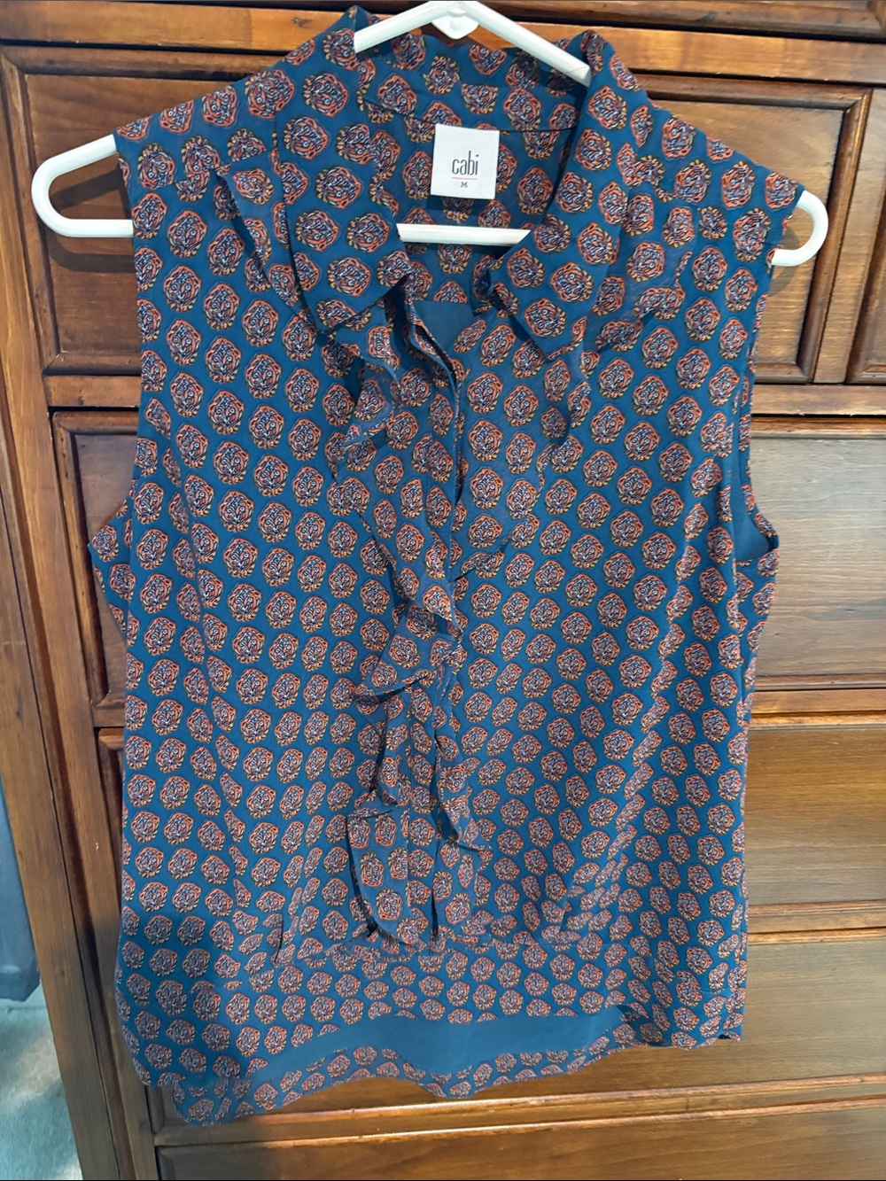 CAbi Navy Sleeveless Ruffle-Front Blouse with Rust Medallion Print